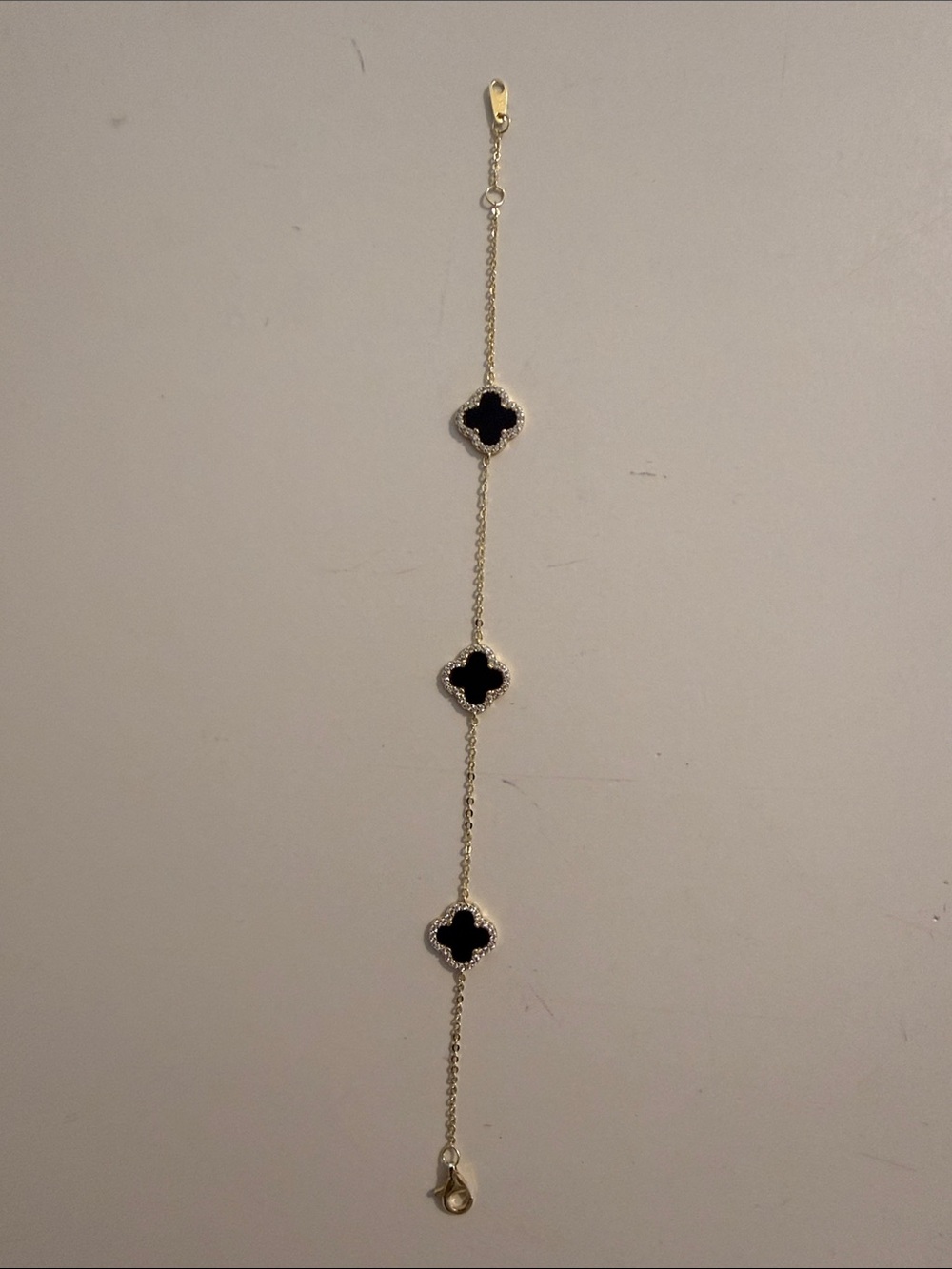 Gold Chain Bracelet with Black Clover Accents